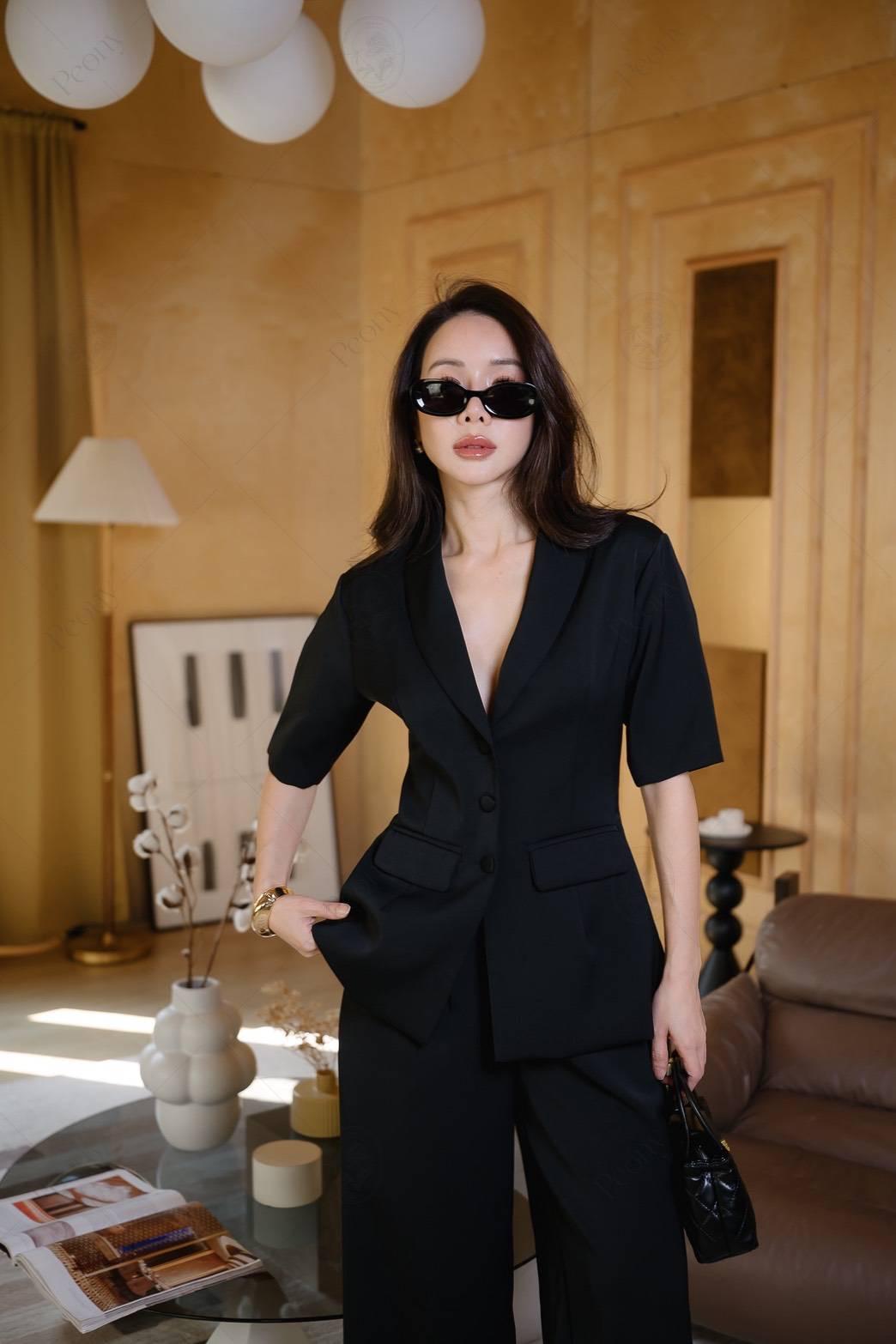 women two piece set black short-sleeve tailored blazer and wide leg pants.