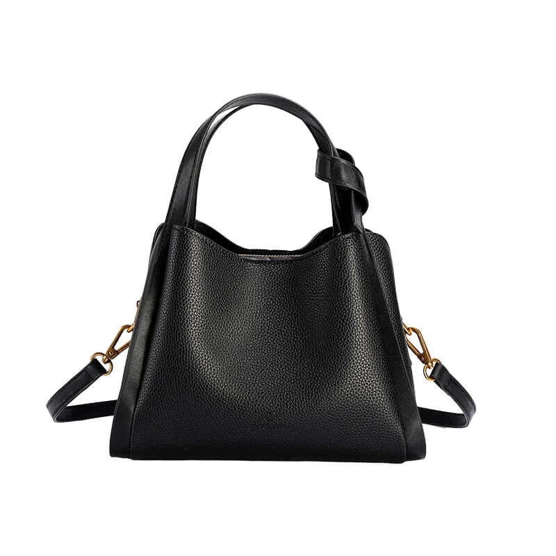 Black handbag with gold accents on a white background