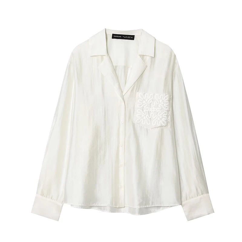 White blouse with floral embroidery