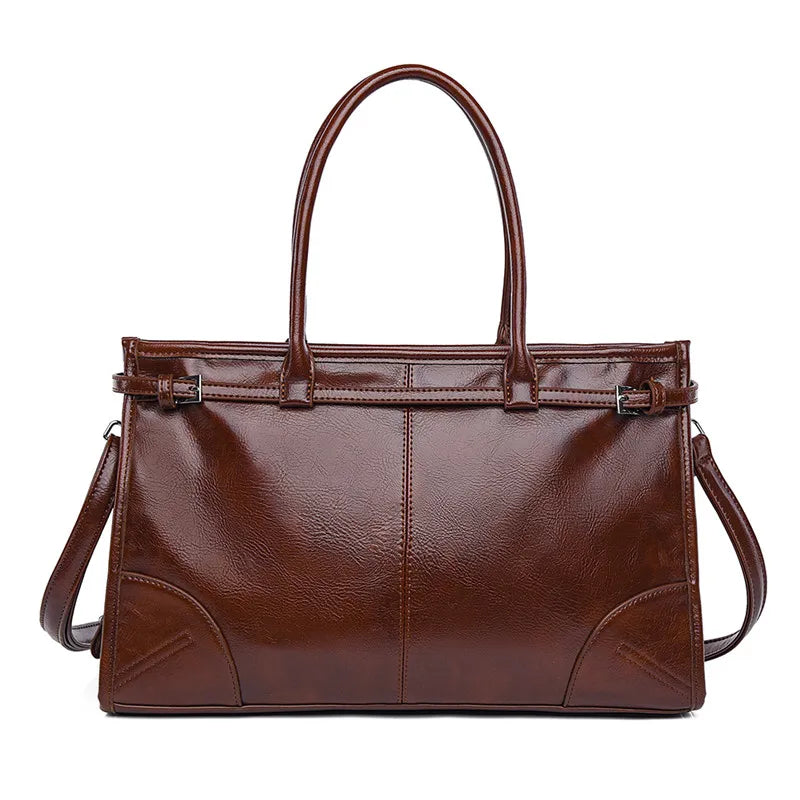 Brown leather handbag with a shoulder strap