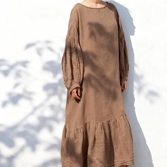 Full-length side view highlighting the relaxed A-line drape and mid-calf hemline of cotton linen dress