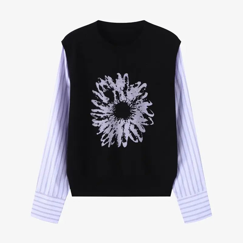 Black sleeveless top with white abstract design on a white background