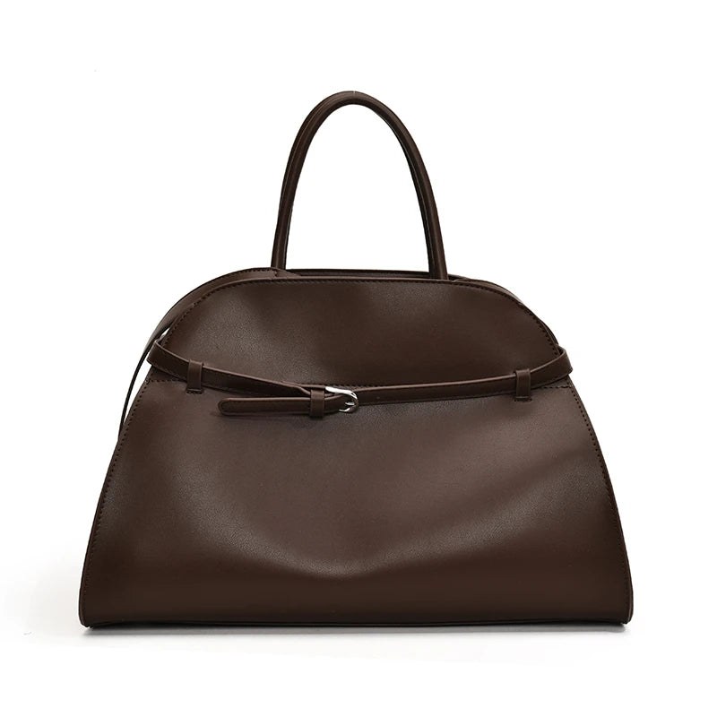 Brown handbag with a strap on a white background