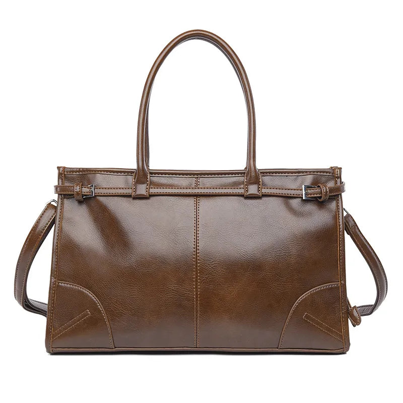 Brown leather handbag with shoulder strap