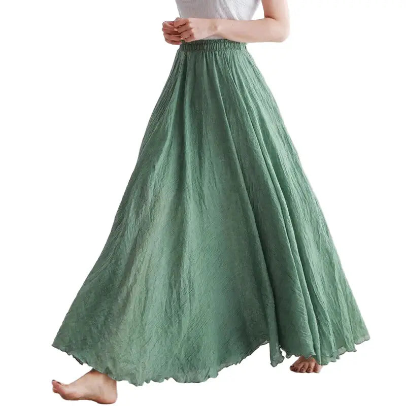 Person wearing a green skirt on a white background