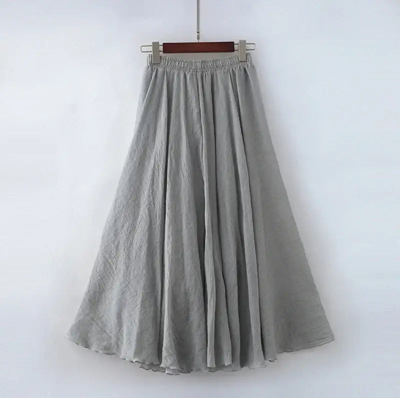 Gray skirt hanging on a white background