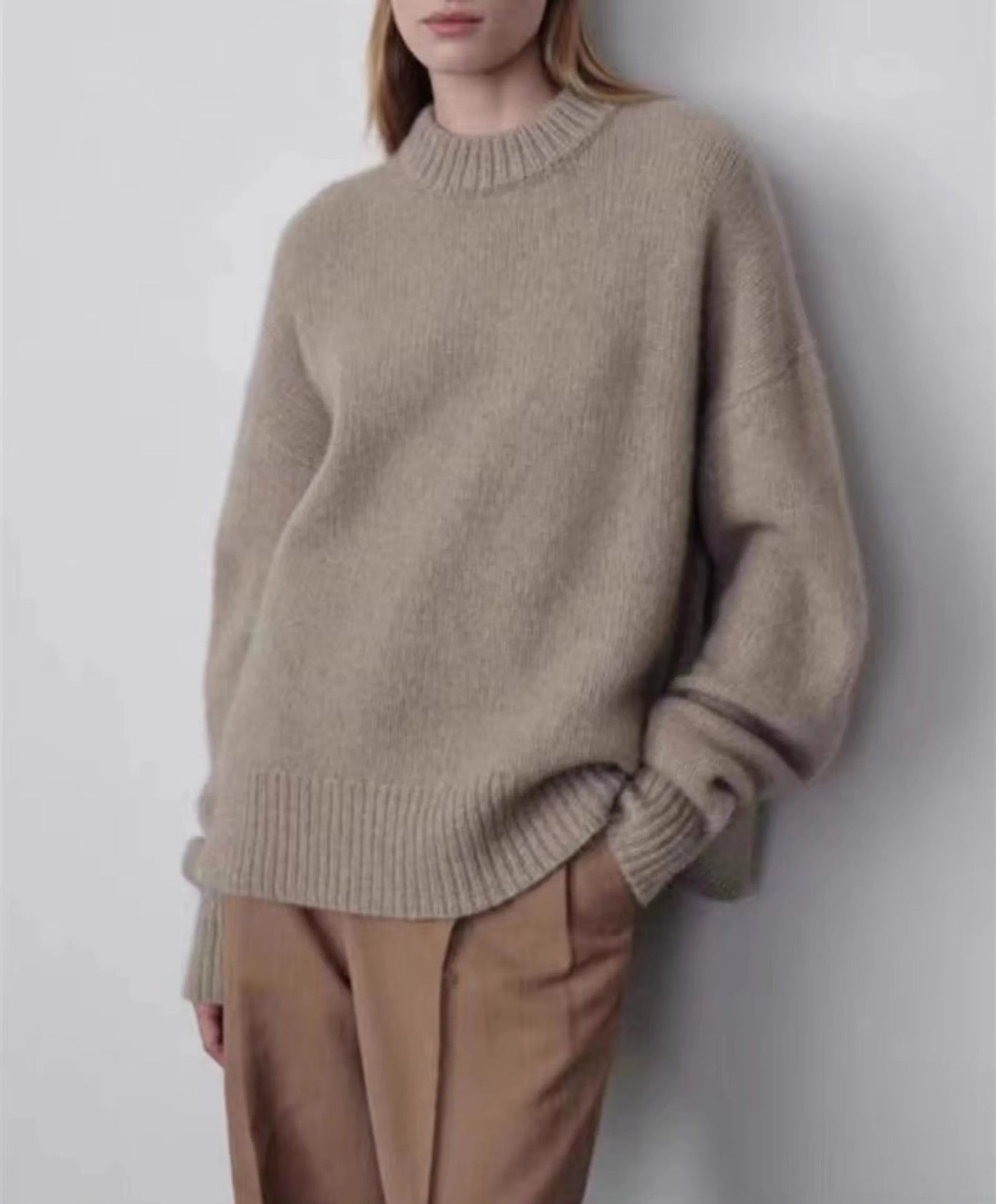 Close-up of heavyweight natural knit texture and ribbed collar on pure cashmere sweater.