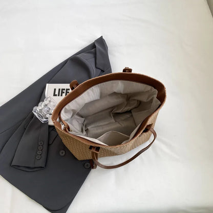 Brown woven bag with gray interior on a white surface next to a gray jacket and 'LIFE' magazine.
