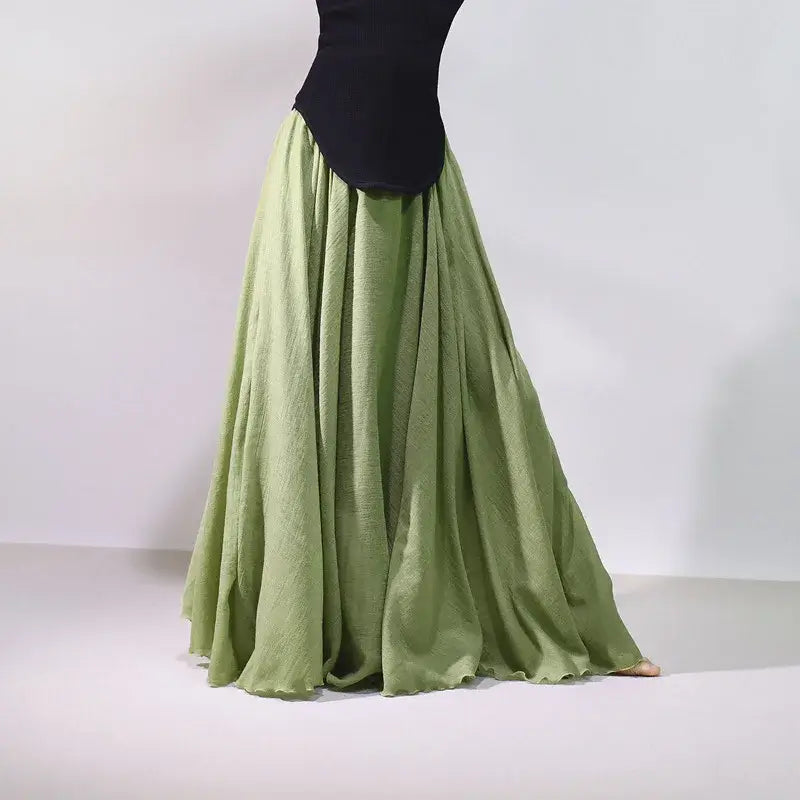 Green long skirt with a black top on a white background