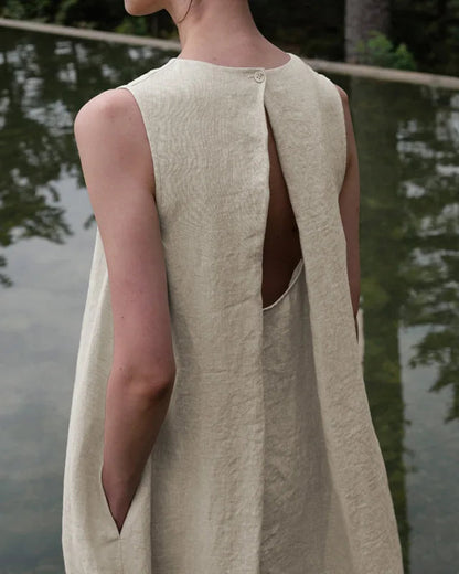 Lifestyle shot of the effortless linen-blend long dress flowing naturally in the summer breeze.