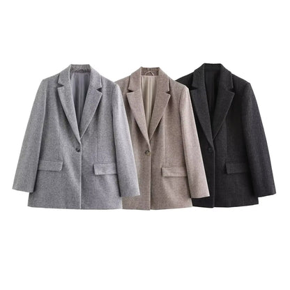 Three blazers in gray, beige, and black on a white background
