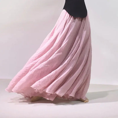Pink long skirt with a black top on a light background