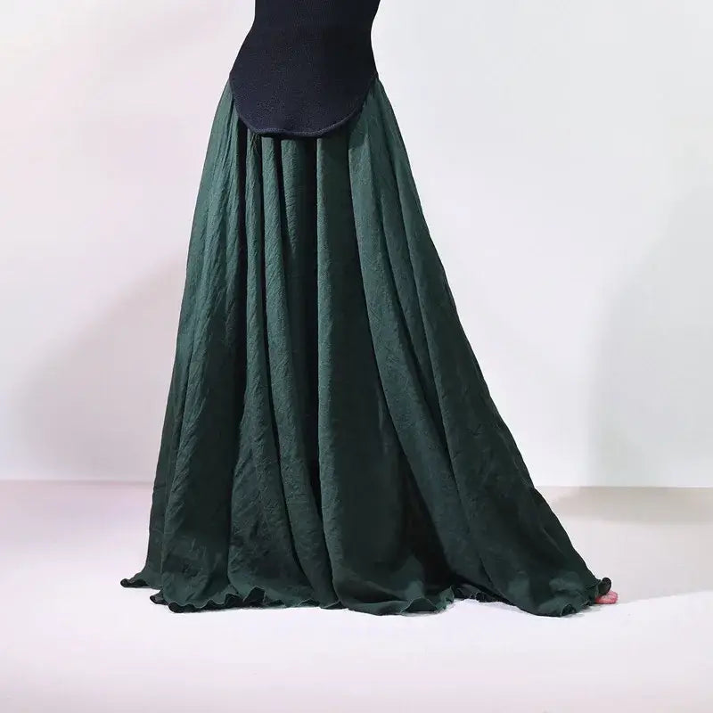 Green skirt with a black top on a white background