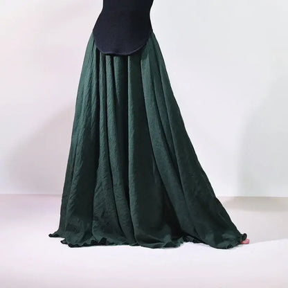 Green skirt with a black top on a white background