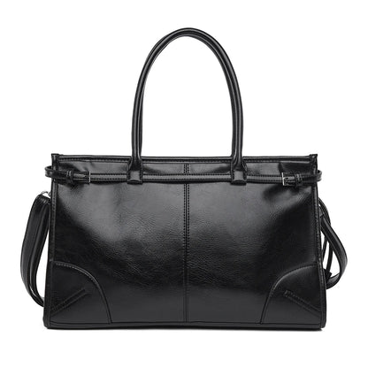 Black leather handbag with a shoulder strap 