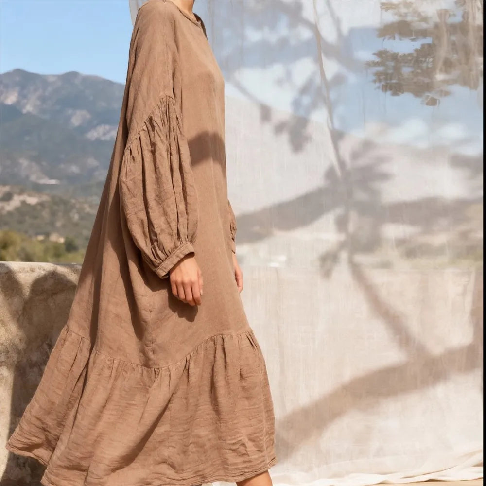 Full-length side view highlighting the relaxed A-line drape and mid-calf hemline of cotton linen dress