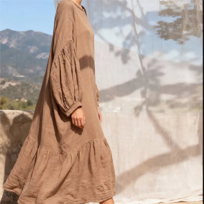 Full-length side view highlighting the relaxed A-line drape and mid-calf hemline of cotton linen dress