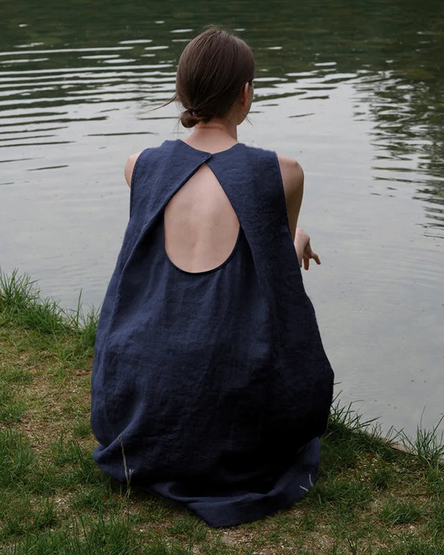 Close-up back view highlighting the delicate button closure and hollow-out keyhole detail on the breathable linen summer dress.