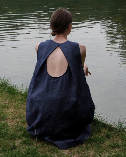 Close-up back view highlighting the delicate button closure and hollow-out keyhole detail on the breathable linen summer dress.
